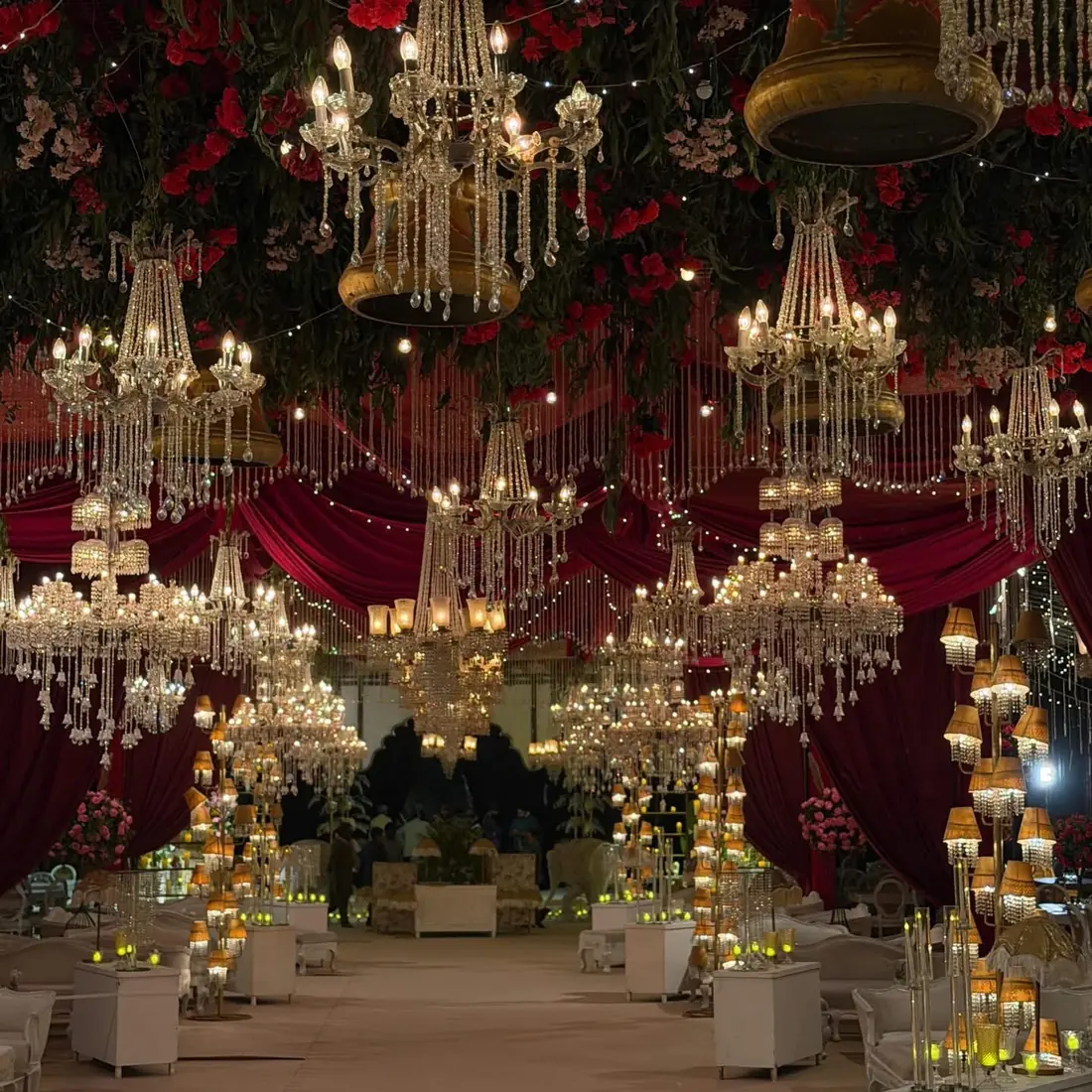 Red velvet marquee with crystal chandeliers by Events by OT