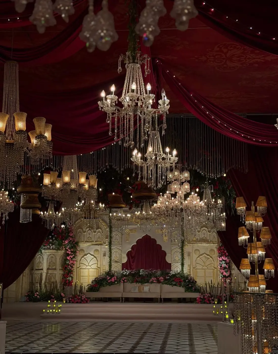 Red velvet stage with chandeliers by Events by OT