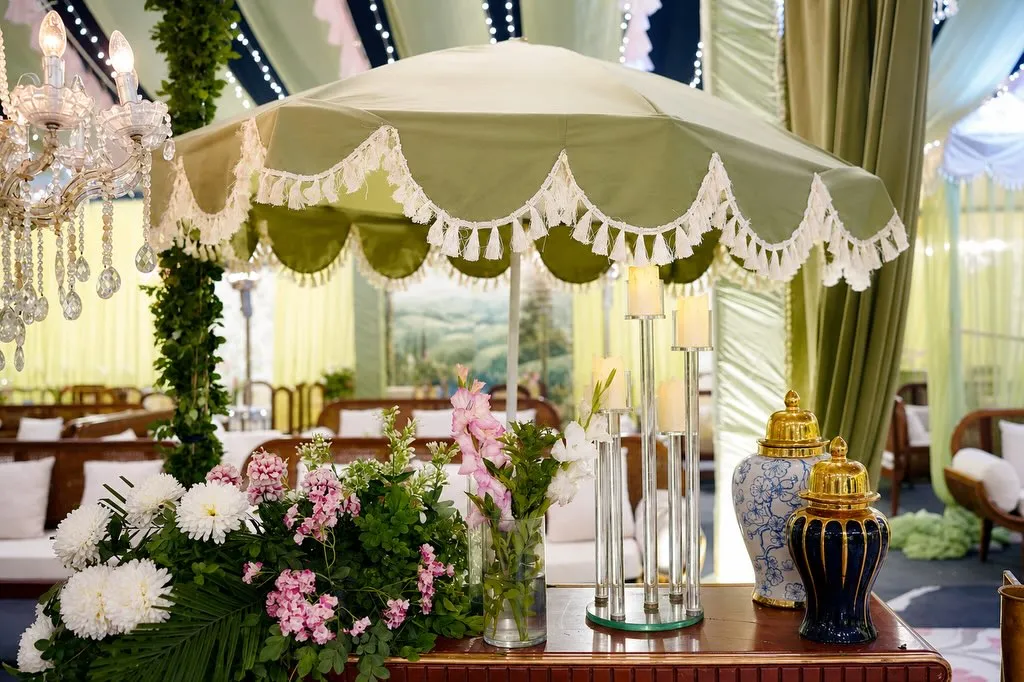 Scalloped umbrella lounge with orchids by Events by OT